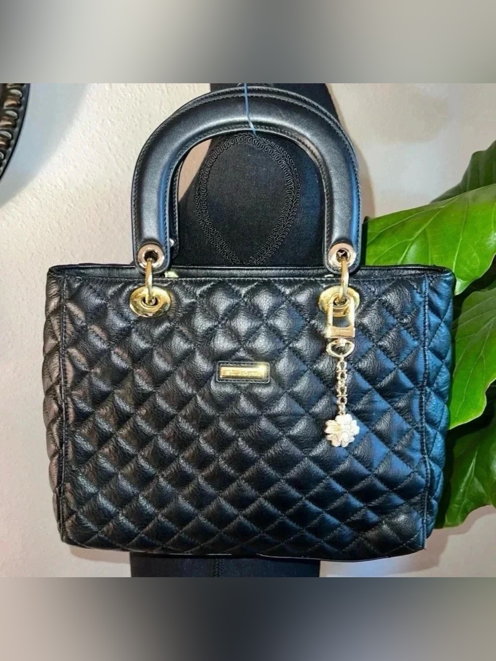 St. John Women's Black Leather Quilted Handbag
Purse Gold Tone hardware w/ Charm